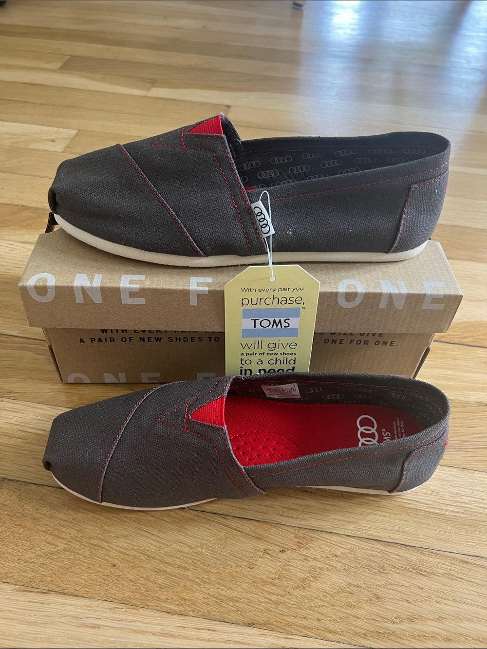 NWT TOMS Classic Slip-On Sneakers — Charcoal Grey with Red Stitching